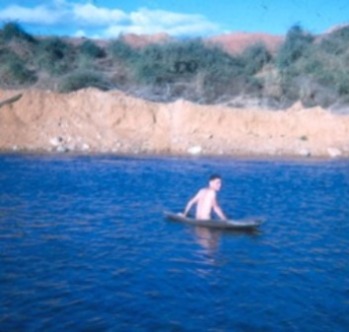 Tom on a raft in the river